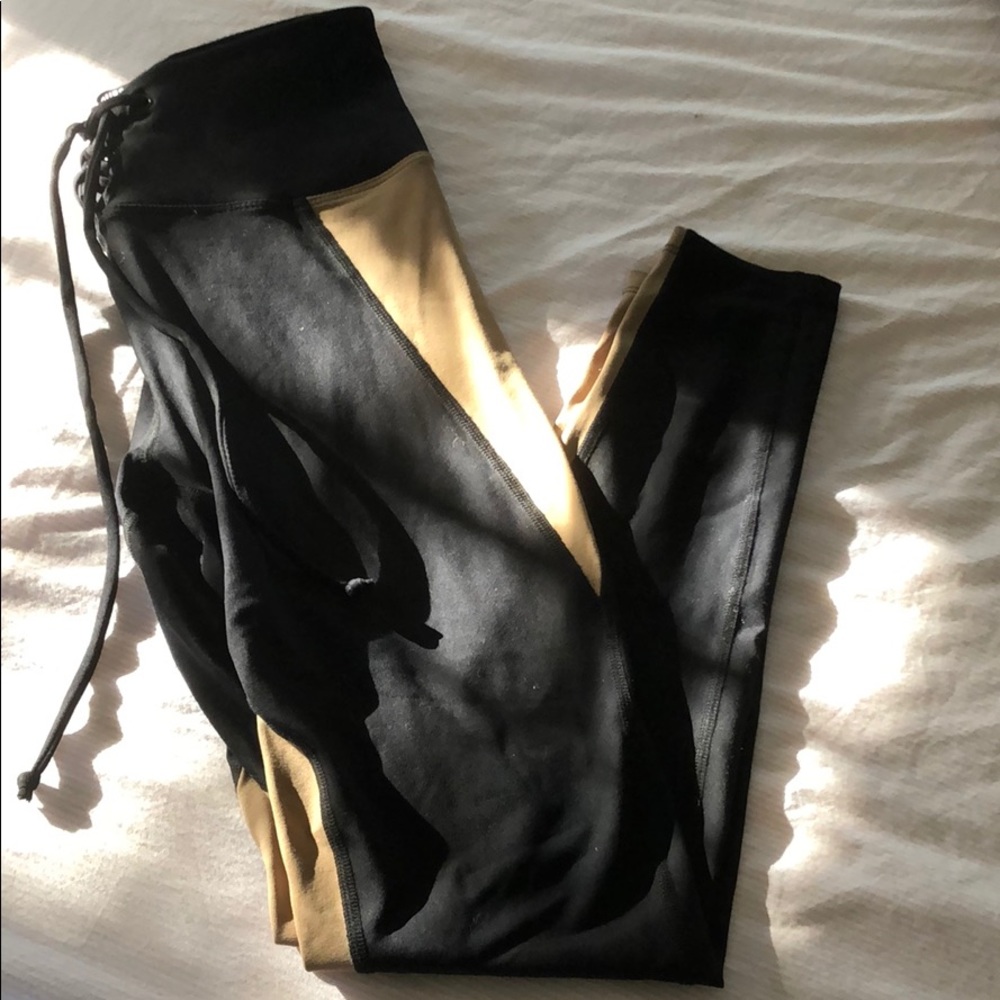 Tan and Black Year of Ours leggings,